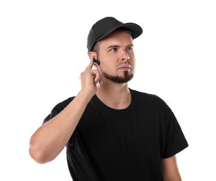 Photo of Young bodyguard with earpiece isolated on white