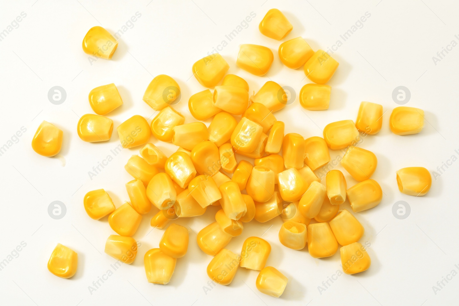 Photo of Pile of fresh corn kernels on white background, flat lay