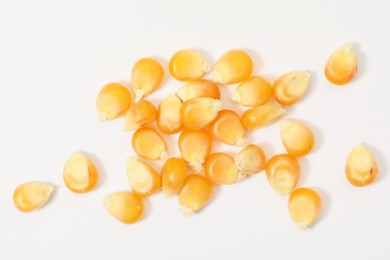 Photo of Many fresh corn kernels on white background, flat lay