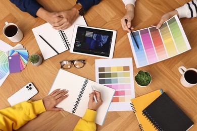 Group of designers working together at table, closeup