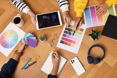 Group of designers working together at table, closeup