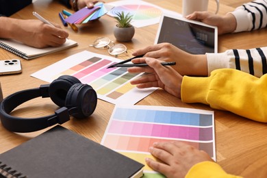 Group of designers working together at table, closeup