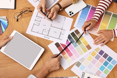 Group of designers working together at table, closeup