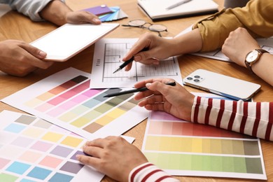 Group of designers working together at table, closeup