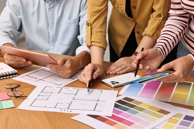 Group of designers working together at table, closeup