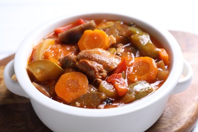 Photo of Delicious stew with vegetables in bowl on table, closeup