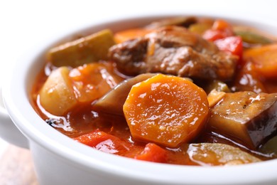 Delicious stew with vegetables in bowl, closeup