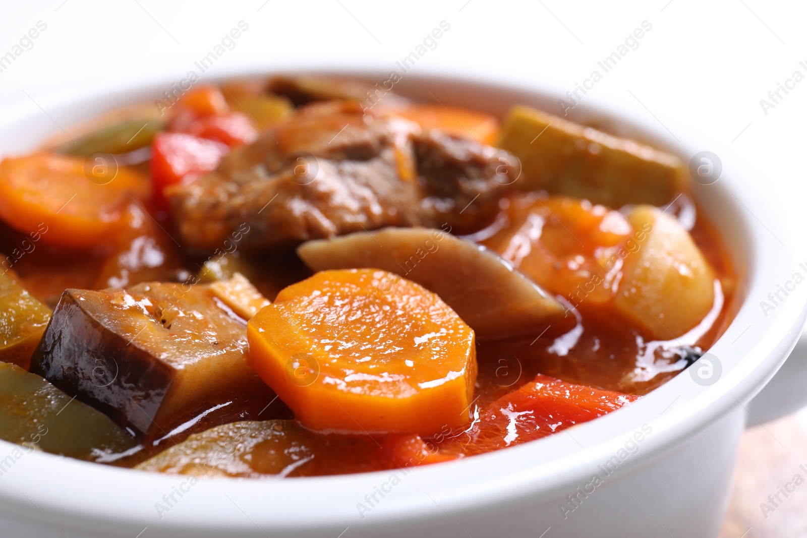 Photo of Delicious stew with vegetables in bowl, closeup