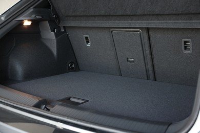 Photo of Grey soft car boot liner mat in trunk of auto