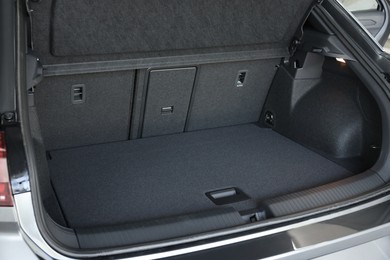 Photo of Grey soft car boot liner mat in trunk of auto