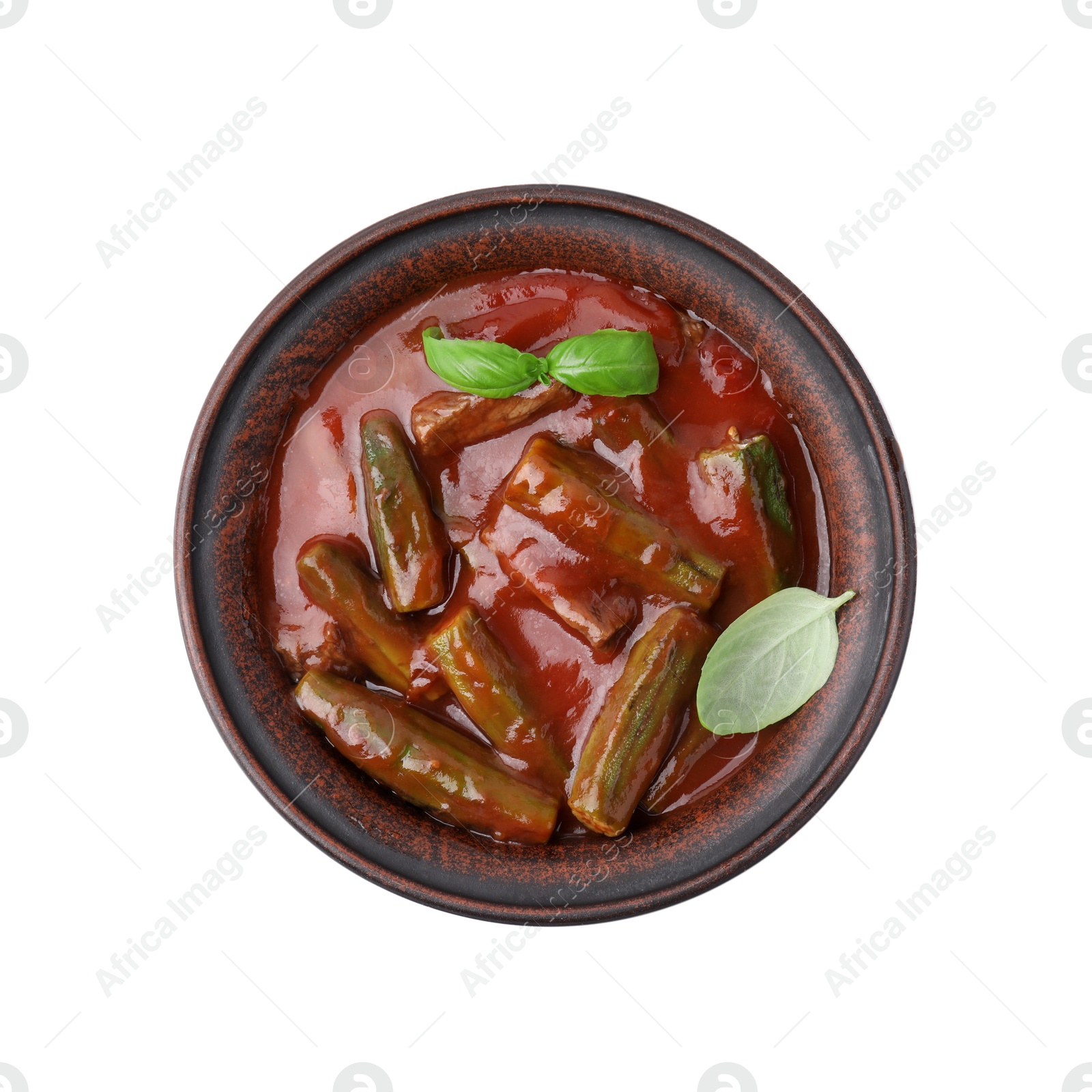 Photo of Tasty stew with okra, tomato sauce and basil isolated on white, top view