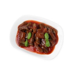 Photo of Tasty stew with okra, tomato sauce and basil isolated on white, top view