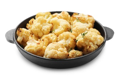 Baked cauliflower in baking dish on white background