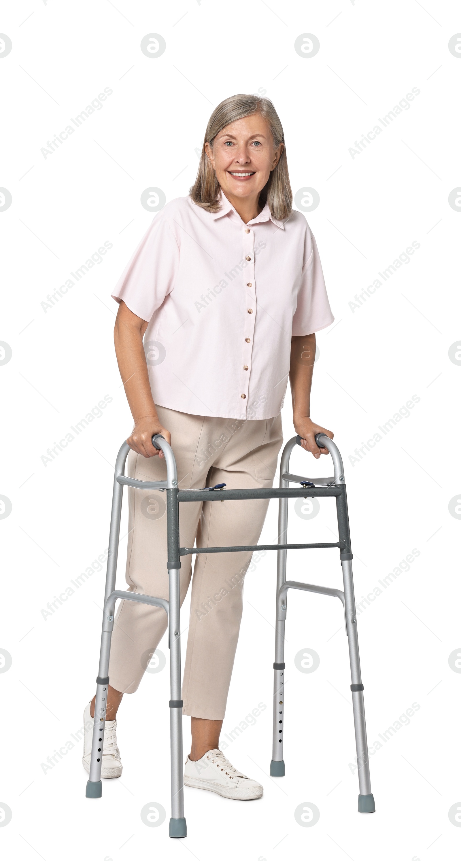 Photo of Senior woman using walking frame on white background