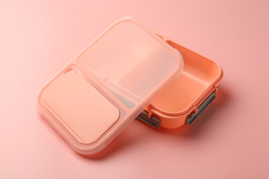 Photo of Empty plastic lunch box on pink background