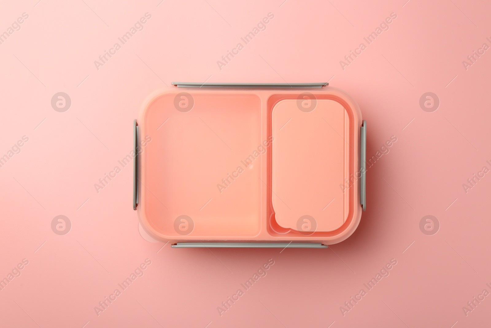 Photo of Empty lunch box on pink background, top view