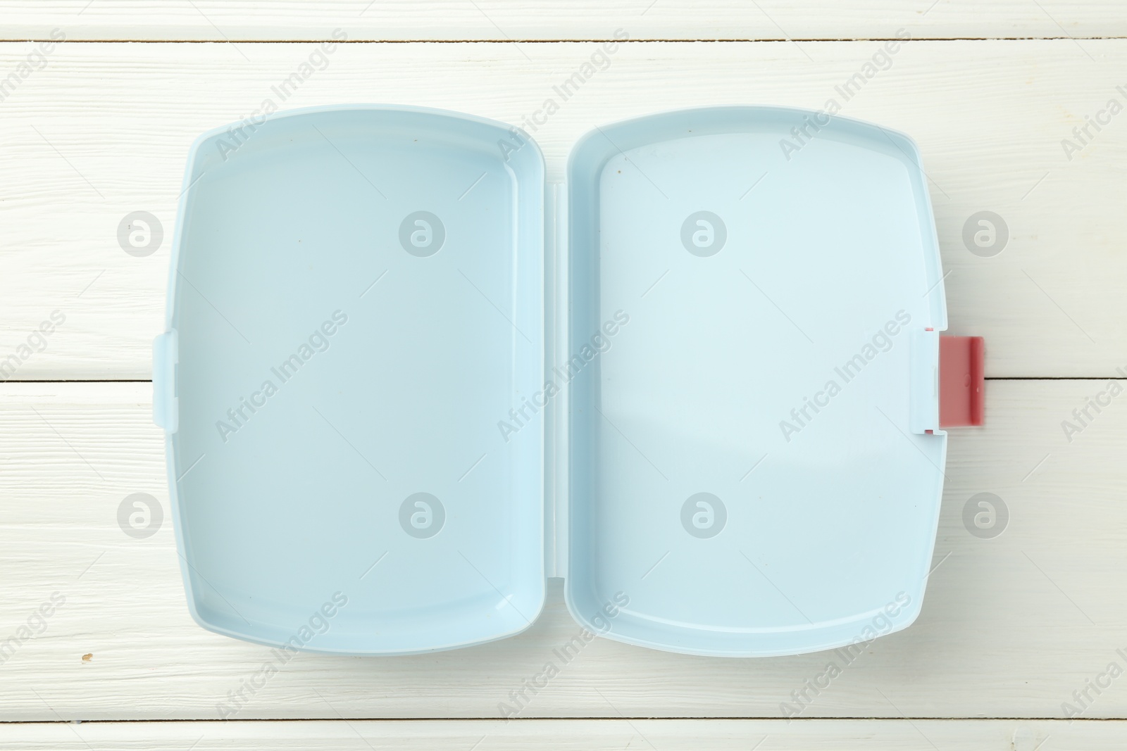 Photo of Empty lunch box on white wooden table, top view