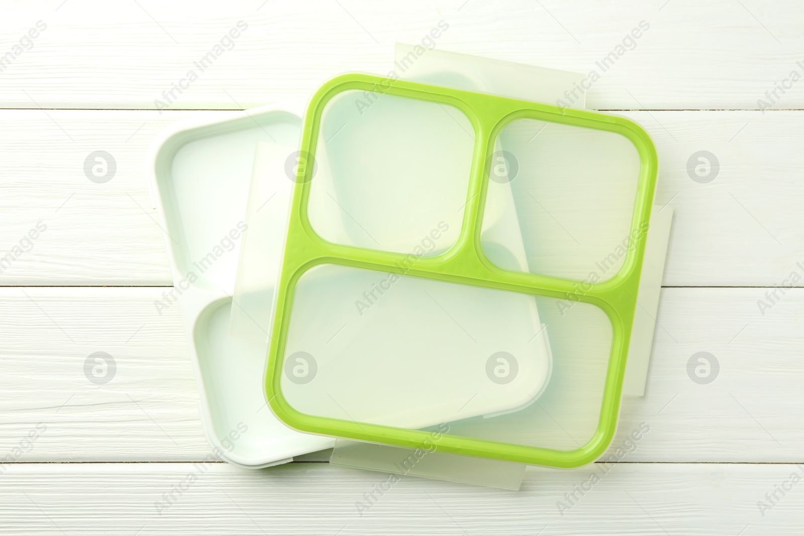 Photo of Empty lunch box on white wooden table, top view