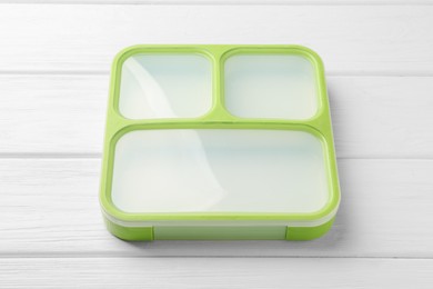 Photo of Empty lunch box on white wooden table