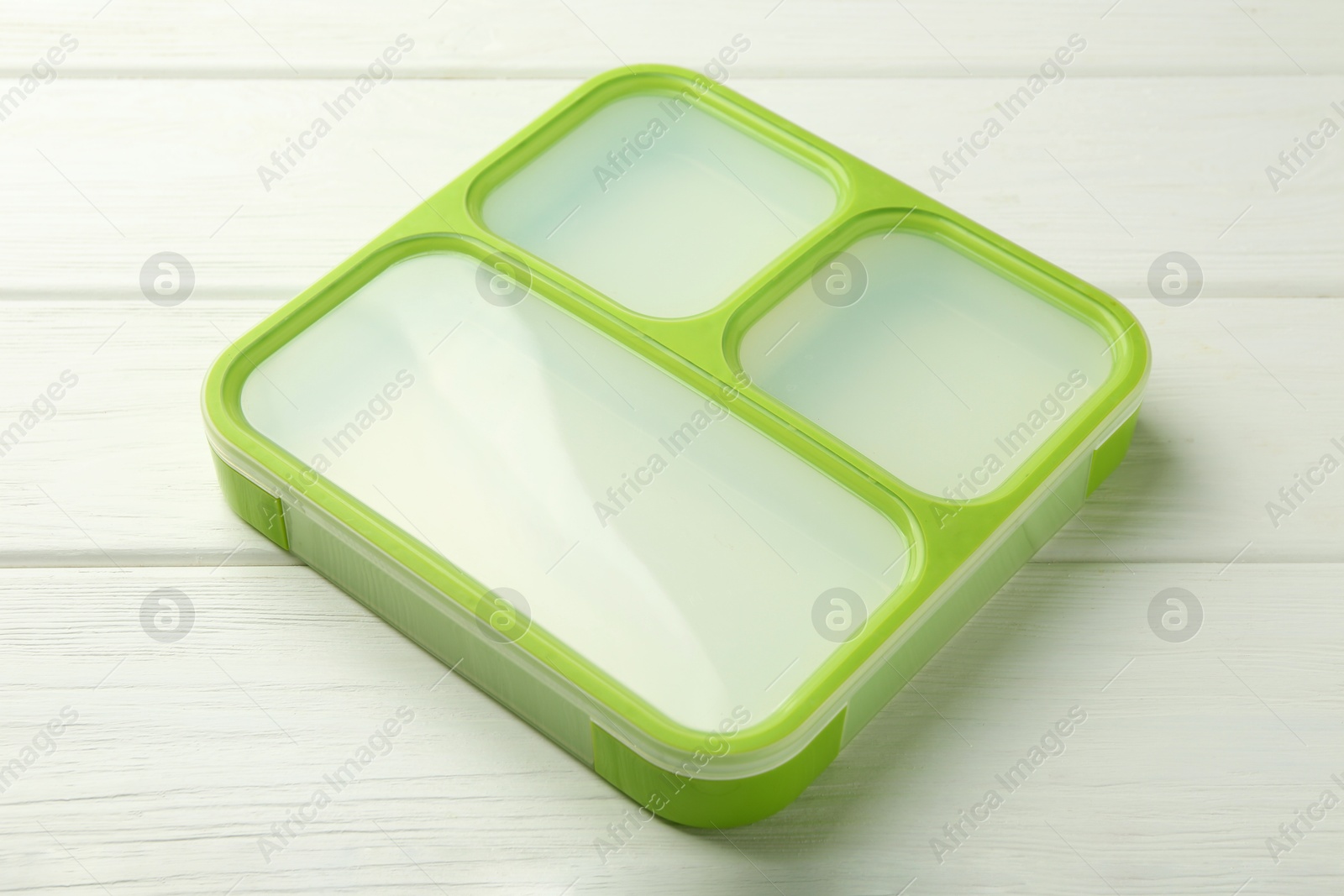 Photo of Empty lunch box on white wooden table