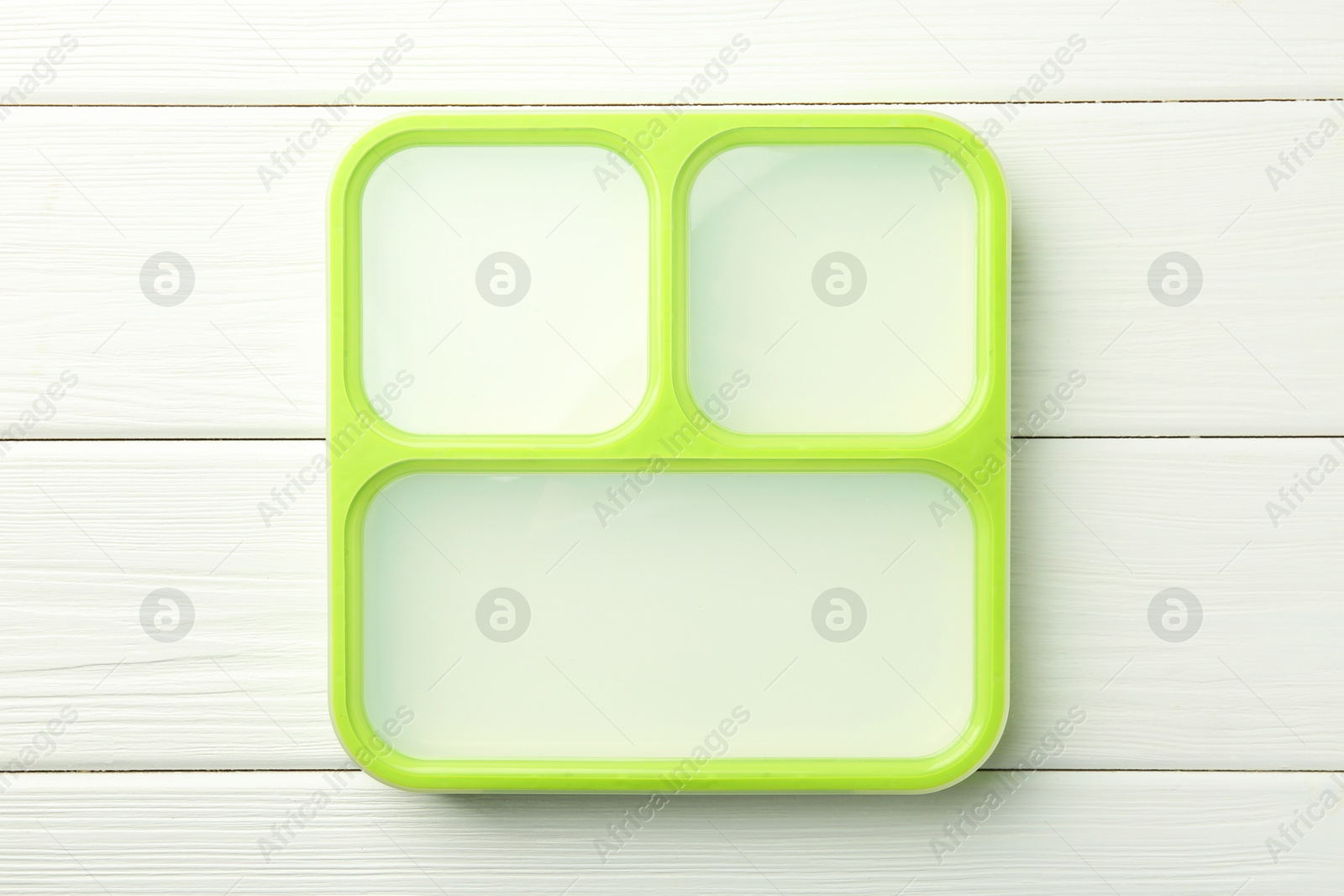 Photo of Empty lunch box on white wooden table, top view