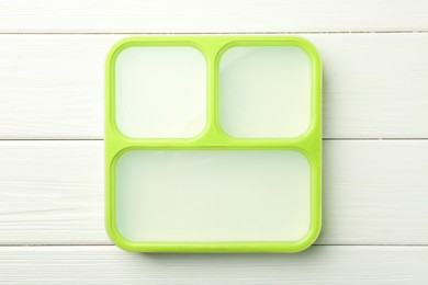 Photo of Empty lunch box on white wooden table, top view