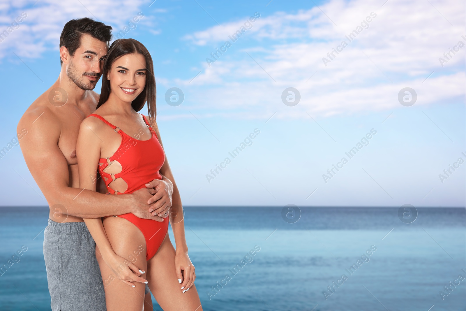 Image of Happy couple enjoying their honeymoon at sea