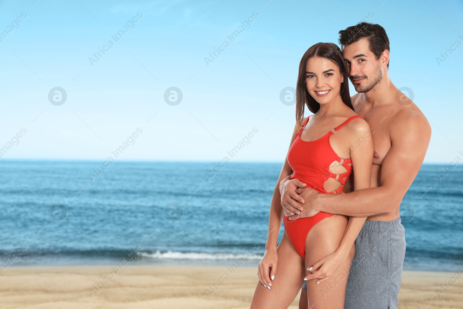 Image of Happy couple enjoying their honeymoon at sea