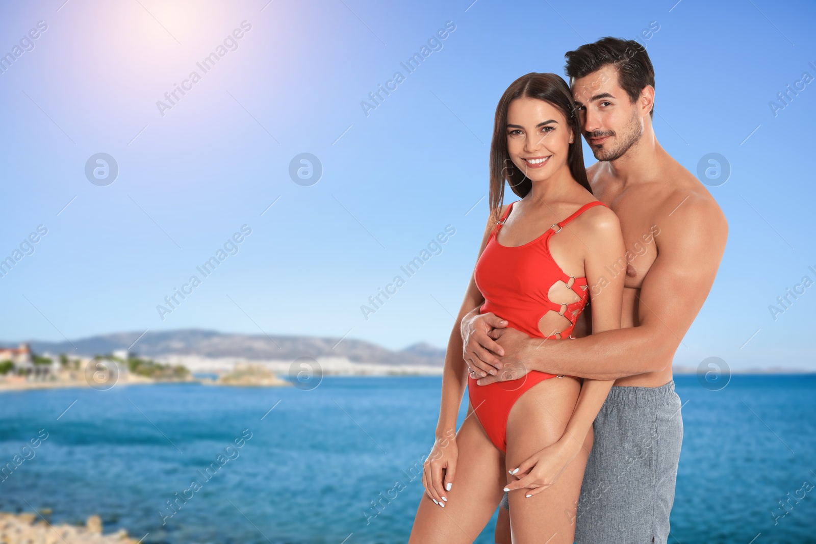 Image of Happy couple enjoying their honeymoon at sea