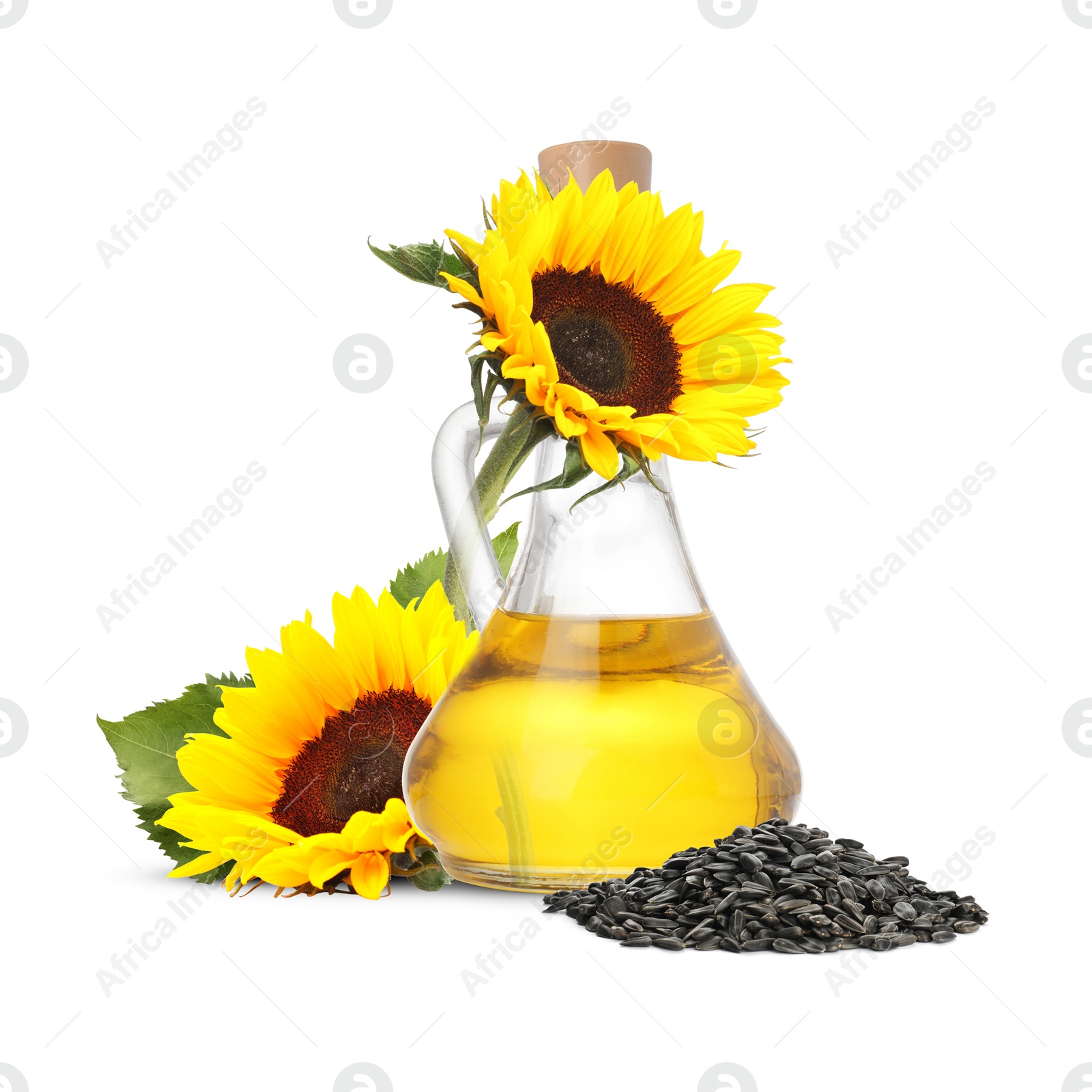 Image of Cooking oil in glass jug, sunflower seeds and flowers isolated on white