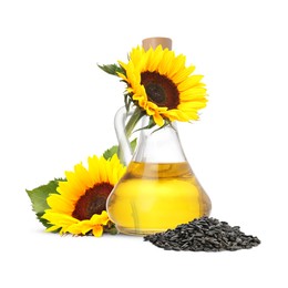 Image of Cooking oil in glass jug, sunflower seeds and flowers isolated on white