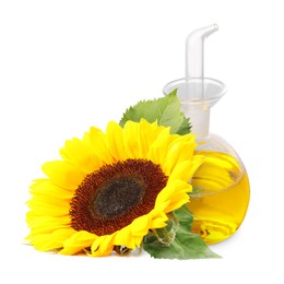 Image of Cooking oil in glass cruet and bright sunflowers isolated on white