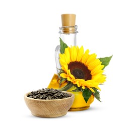 Image of Cooking oil in glass jug, sunflower seeds and flower isolated on white