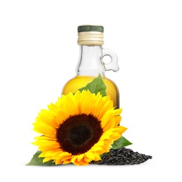 Image of Cooking oil in glass bottle, sunflower seeds and flower isolated on white