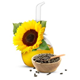 Image of Cooking oil in glass cruet, sunflower seeds and flower isolated on white