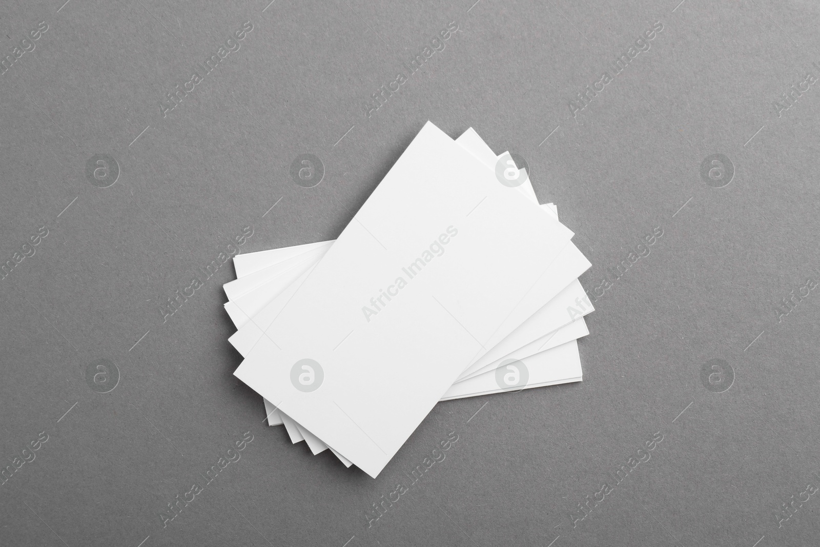 Photo of Blank business cards on grey background, top view. Mockup for design