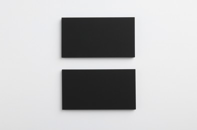 Photo of Blank business cards on light grey background, top view. Mockup for design