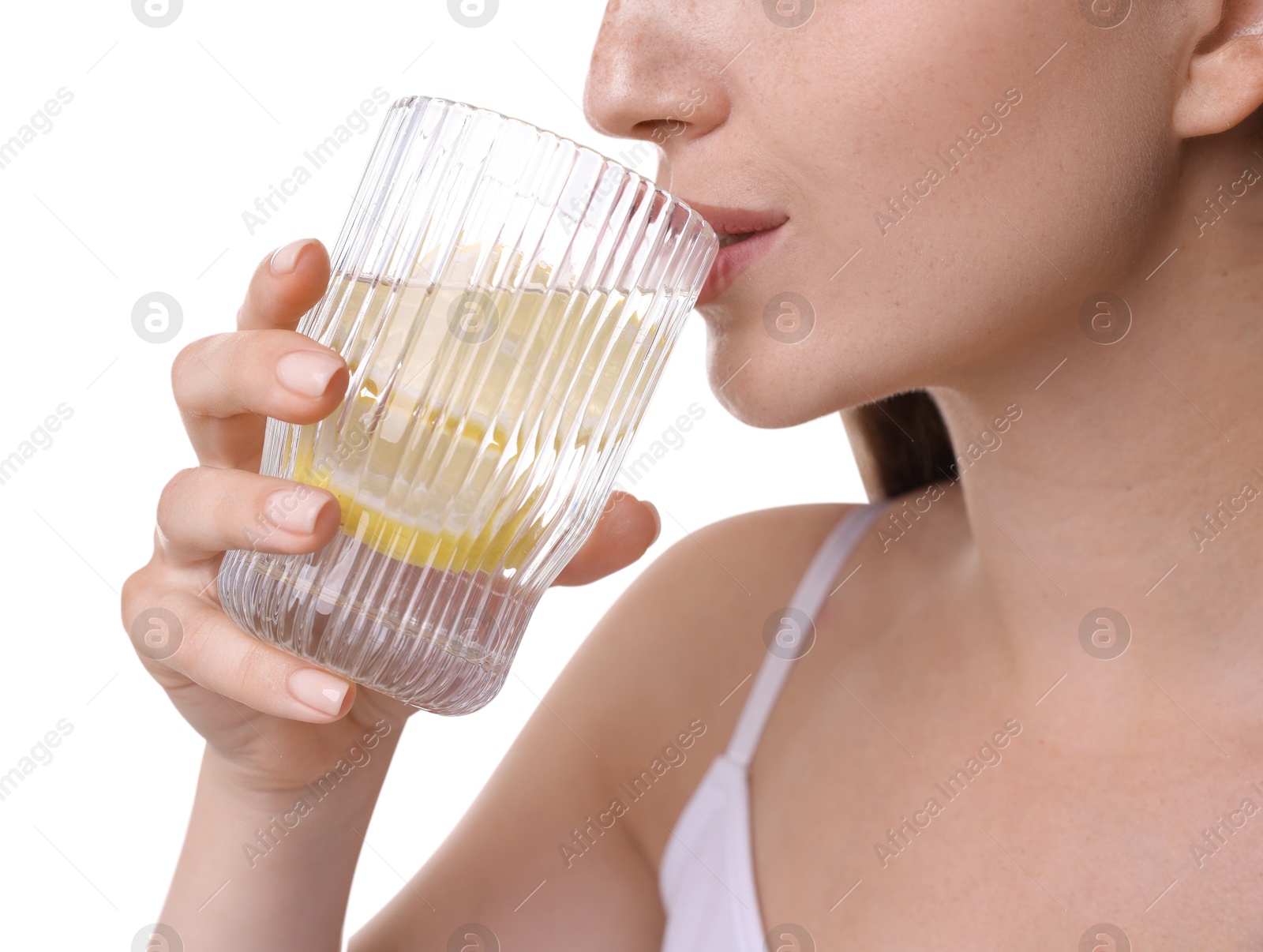 Photo of Woman drinking water with lemon on white background, closeup