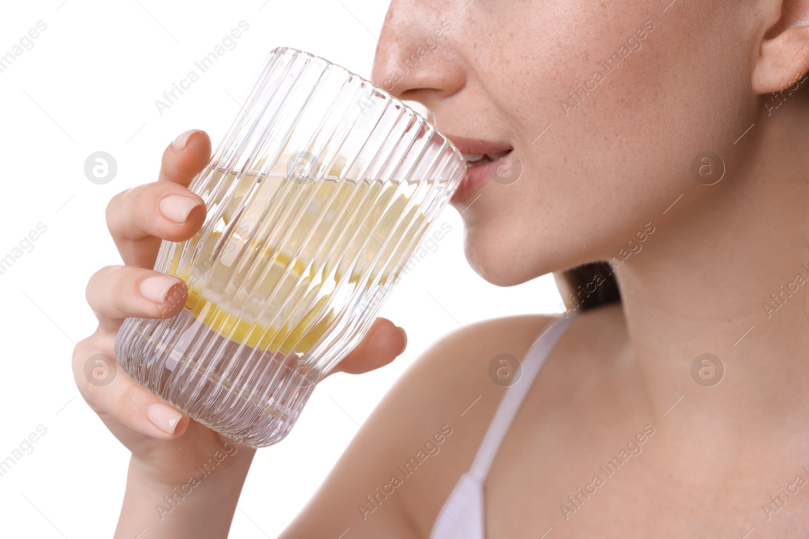 Photo of Woman drinking water with lemon on white background, closeup