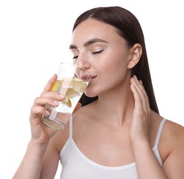 Woman drinking water with lemon on white background