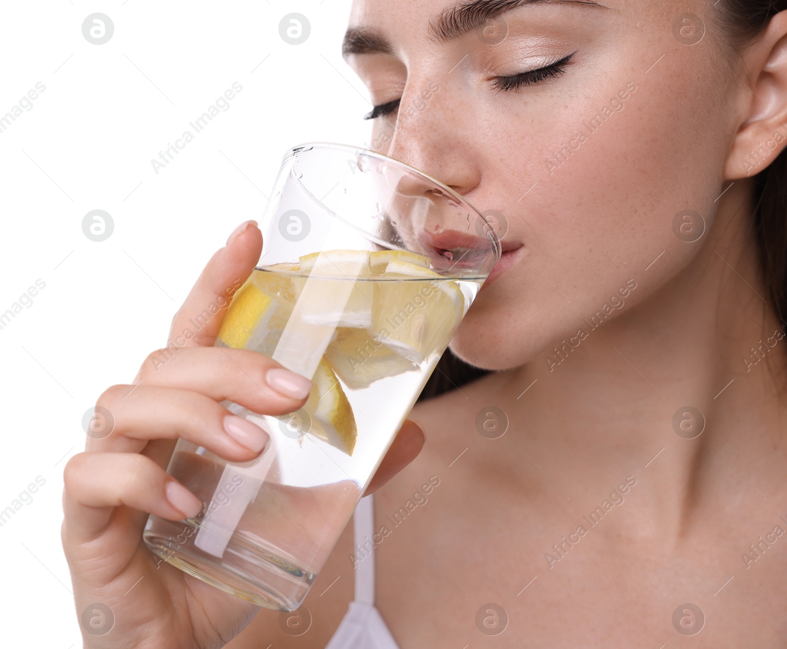 Photo of Woman drinking water with lemon on white background, closeup