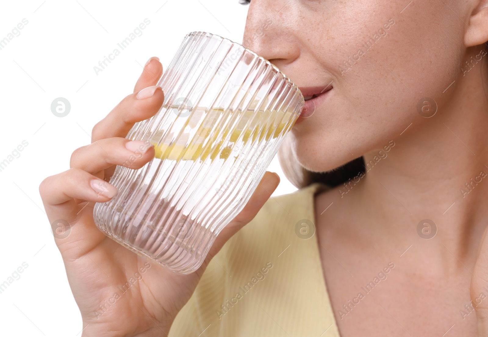 Photo of Woman drinking water with lemon on white background, closeup