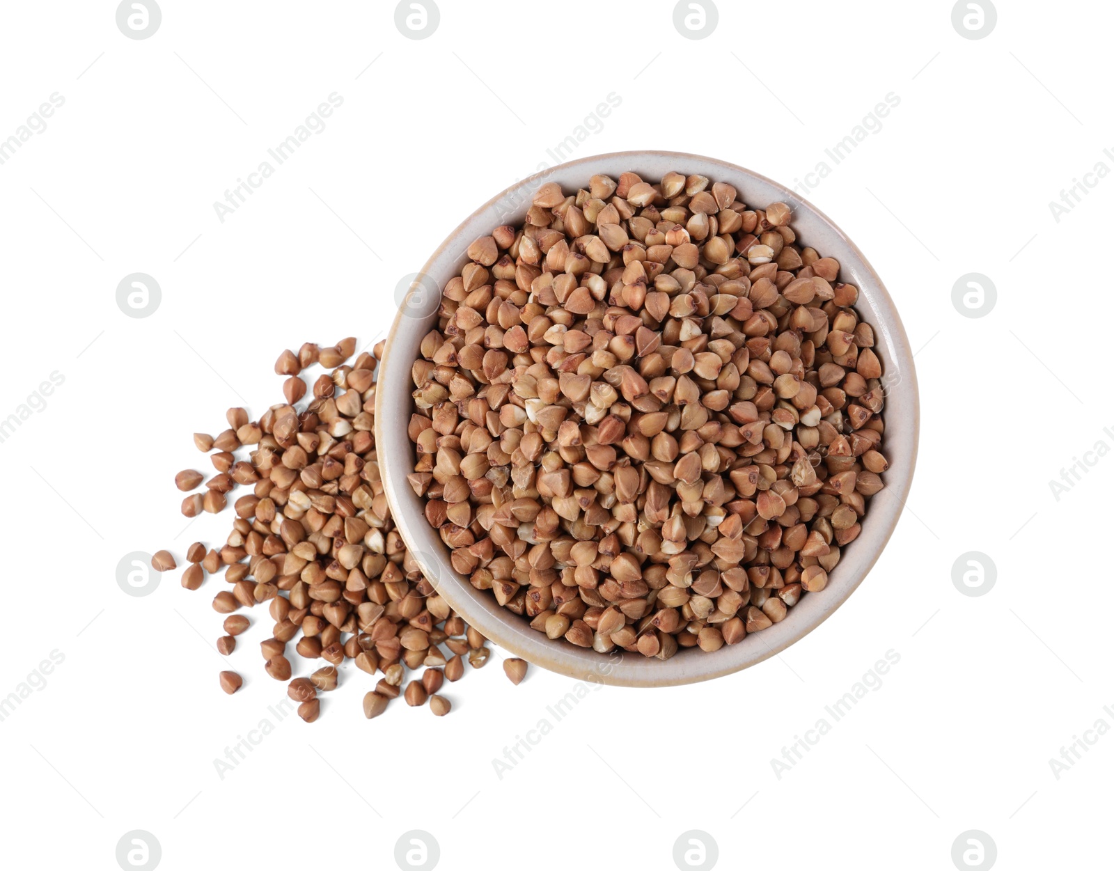 Photo of Raw buckwheat in bowl isolated on white, top view