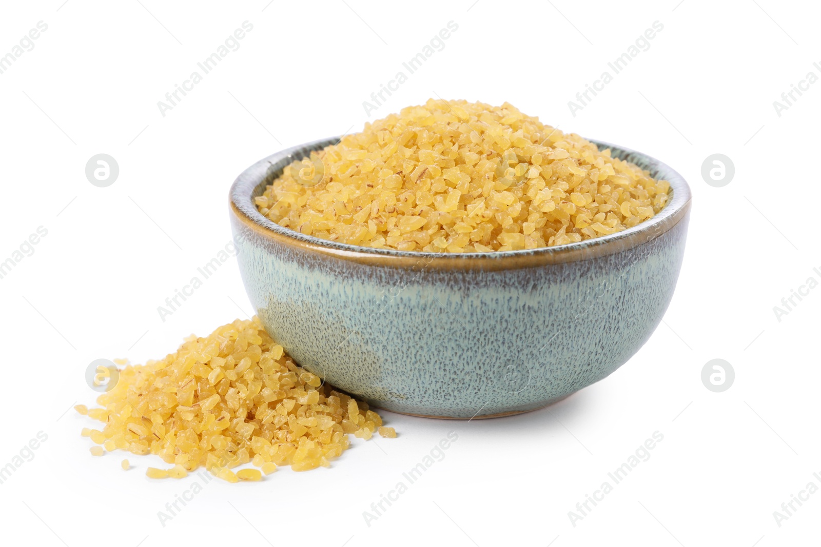 Photo of Raw bulgur in bowl isolated on white