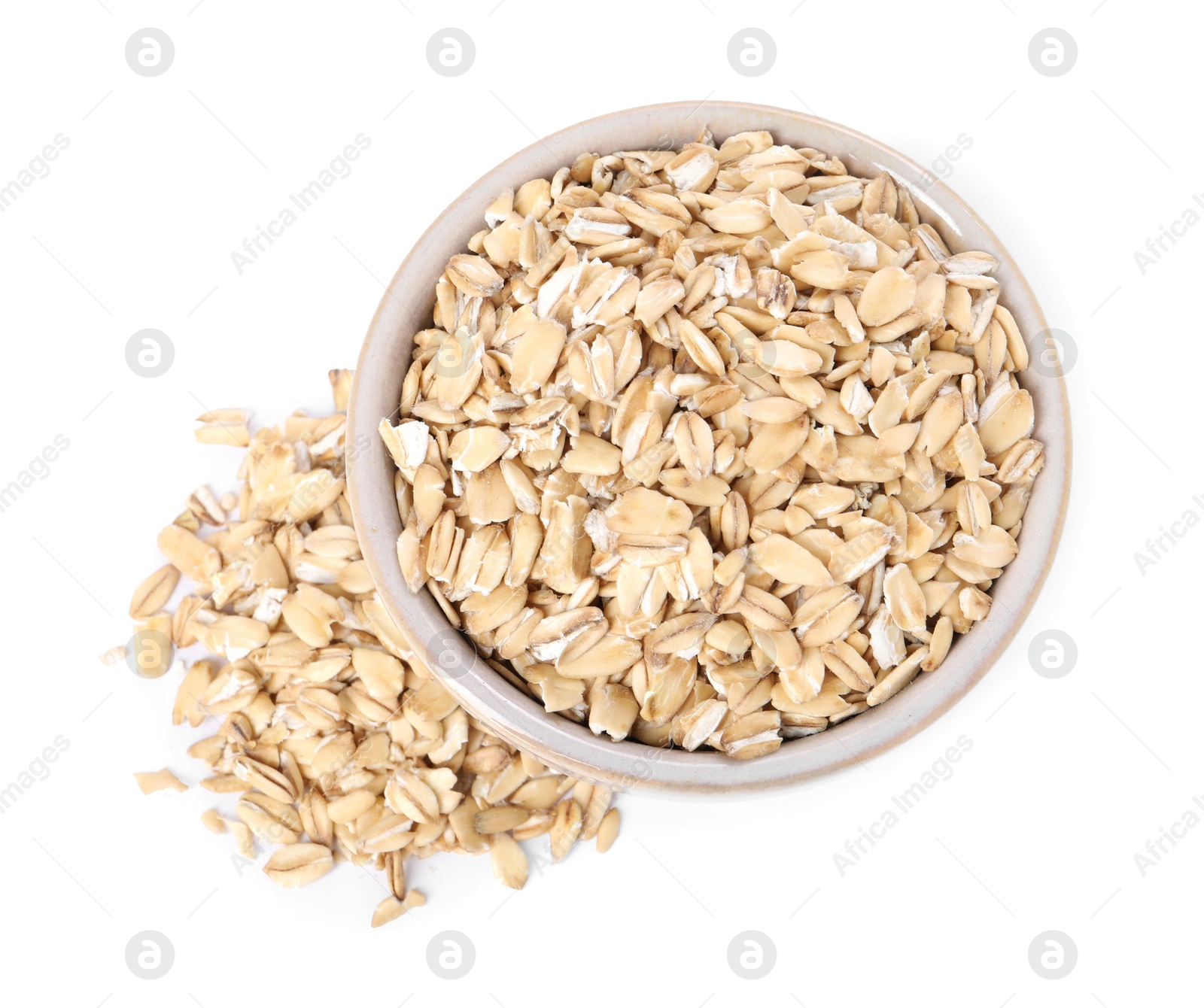 Photo of Dry oat flakes in bowl isolated on white, top view