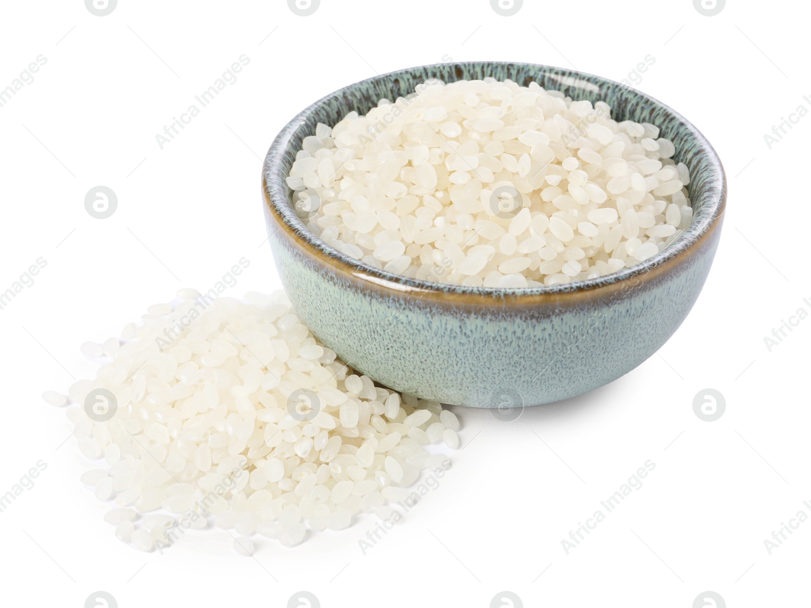 Photo of Raw rice in bowl isolated on white