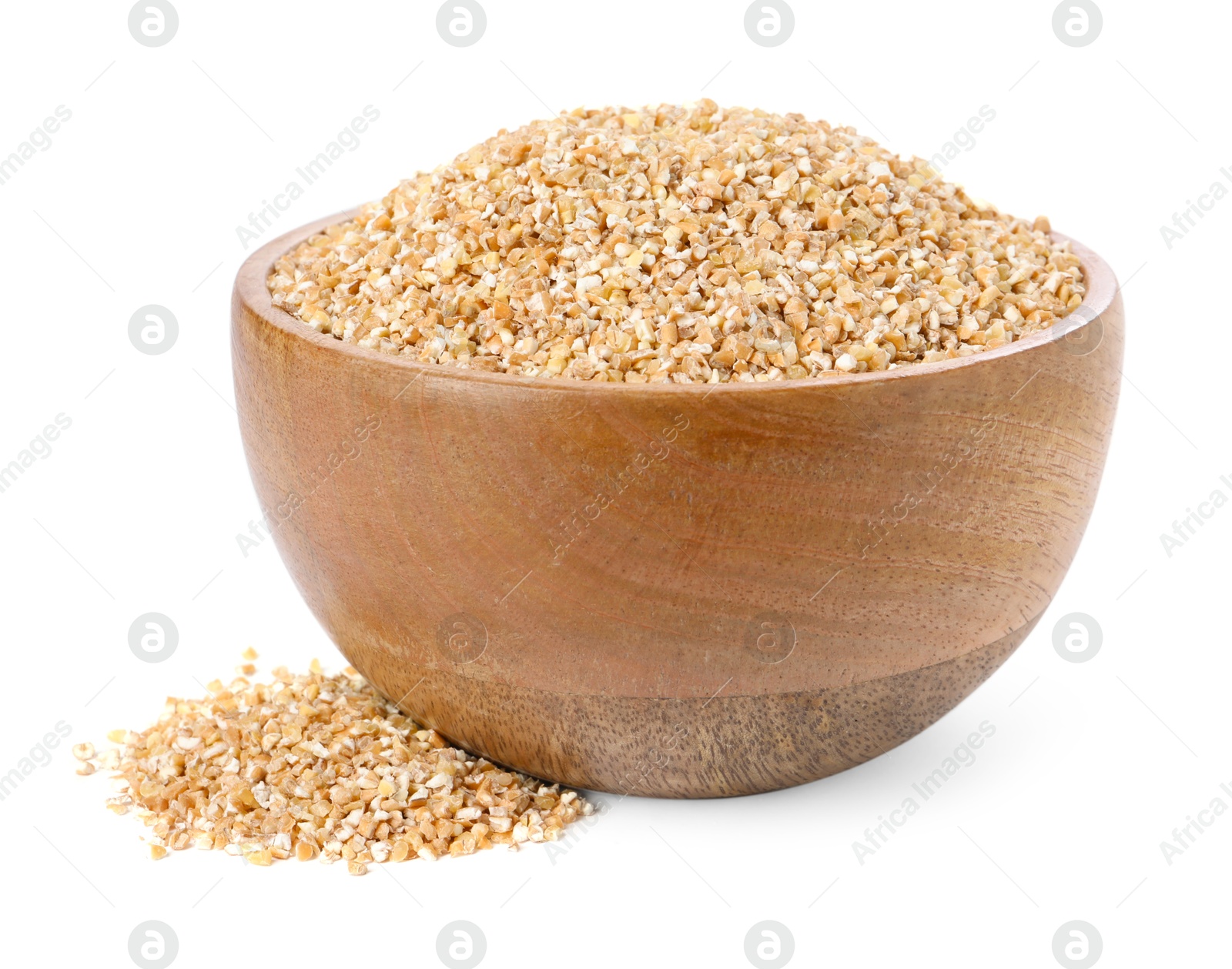 Photo of Dry wheat groats in wooden bowl isolated on white