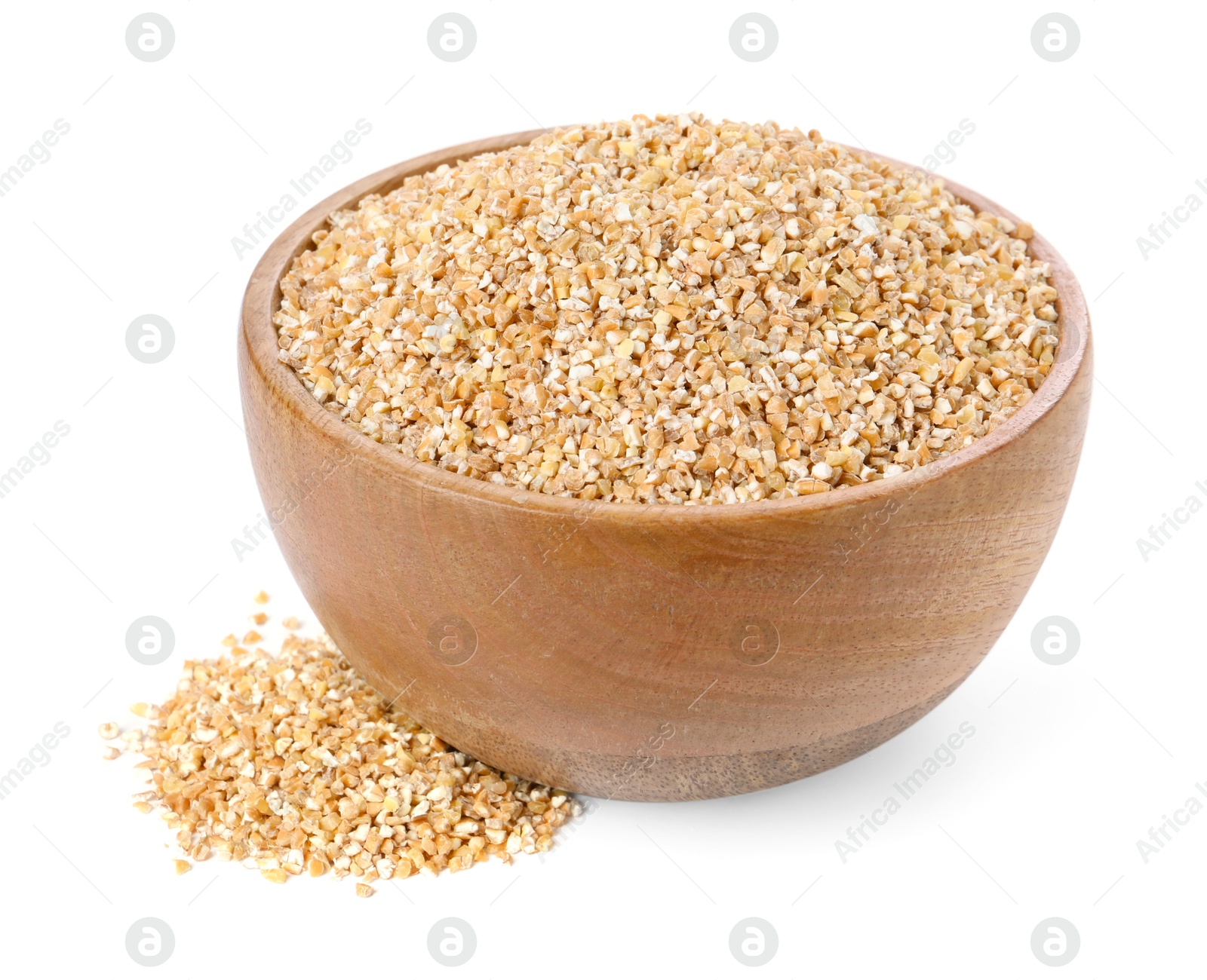 Photo of Dry wheat groats in wooden bowl isolated on white