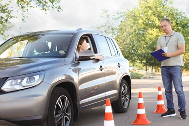 Woman passing maneuverability driving test on track