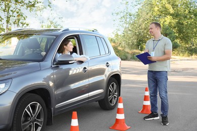 Woman passing maneuverability driving test on track